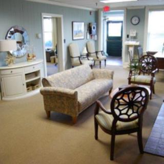 A cozy waiting area with comfortable seating and tasteful decor.