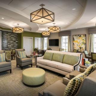 A modern living room with stylish lighting and comfortable seating.
