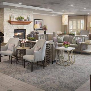 A cozy living room with elegant furniture and a fireplace.