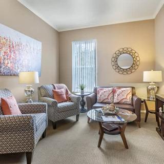 A cozy and well-decorated living room with stylish furniture and modern decor.