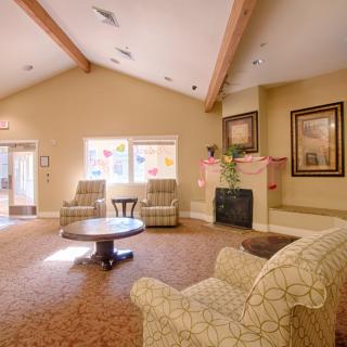 Cozy living room with comfortable seating and a fireplace.