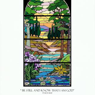 A stained glass artwork depicting a serene landscape with trees, a river, flowers, and a sunset.