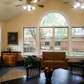 A cozy living room filled with natural light and comfortable furnishings.
