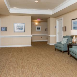 A cozy hallway with comfortable seating and wall decorations.