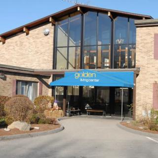 Entrance of a hotel with a blue awning.