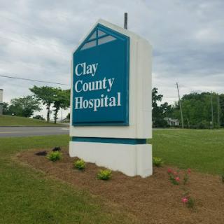 Sign for Clay County Hospital located in a grassy area.