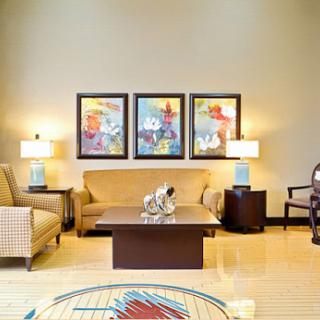 A cozy living room featuring stylish furniture and vibrant artwork.