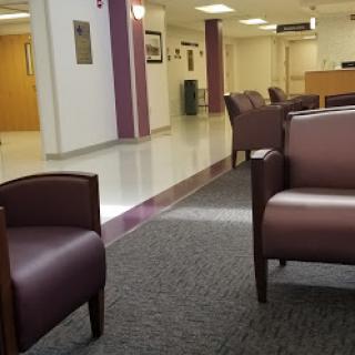 A spacious waiting area featuring comfortable seating, designed for patient comfort.