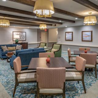 A cozy lounge area with comfortable seating and warm lighting.