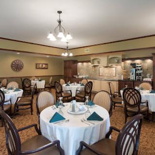 An elegant dining room setup featuring round tables and tasteful decor.
