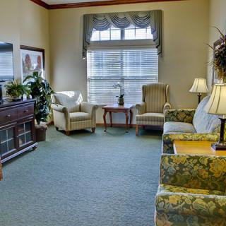 A cozy living room with comfortable seating and a television.