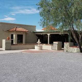 A desert-style house with a courtyard and central fountain.