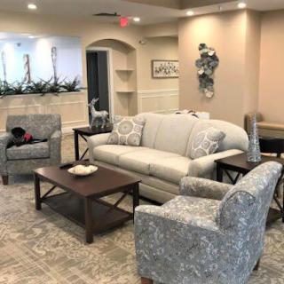 A cozy living room with comfortable seating and elegant decor.