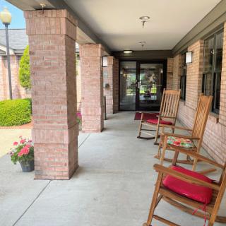 A welcoming porch featuring rocking chairs, inviting you to sit and enjoy the surroundings.