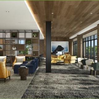 A modern lobby with stylish seating and large windows, featuring a sophisticated interior design.