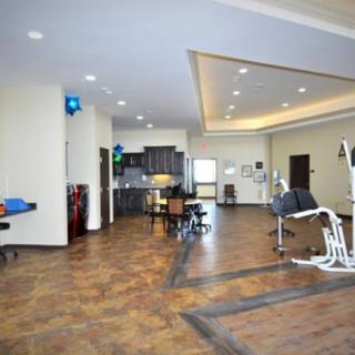 A modern dental office interior with a waiting area and dental chairs.