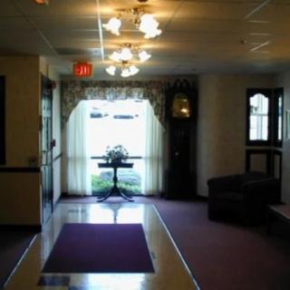 A dimly lit hallway with decorative lighting and furnishings.
