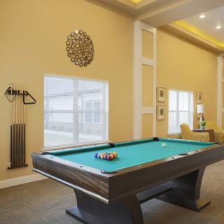 A well-designed game room featuring a pool table ready for play.