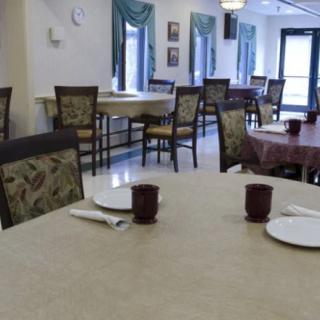 Empty dining area with tables and chairs set up.