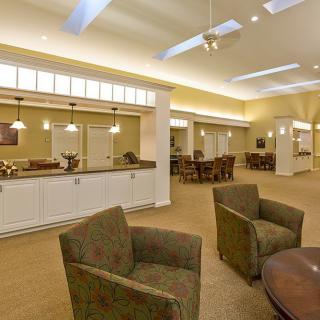 A spacious lobby area with comfortable seating and warm lighting.