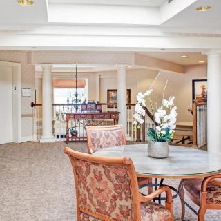 A well-lit lobby area with elegant furniture and decor.