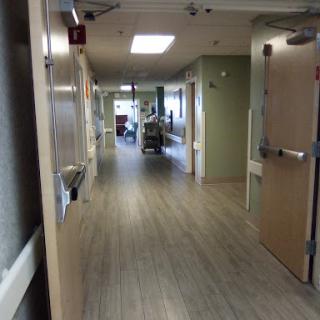 A view of a hospital corridor, showcasing the layout and design of the facility.