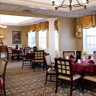 A beautifully decorated dining room with elegant furnishings and cozy lighting.