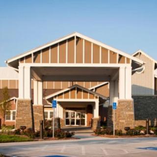 Front view of a modern building entrance during the day.
