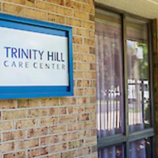 Entrance of Trinity Hill Care Center with visible signage on a brick exterior.