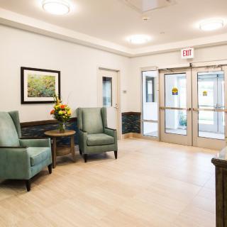 A clean and welcoming lobby area with seating and decor.