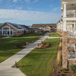 A view of a modern residential community with well-maintained landscaping and walkways.