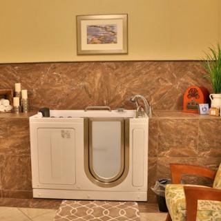A luxurious bathroom featuring an accessible walk-in bathtub with elegant decor.