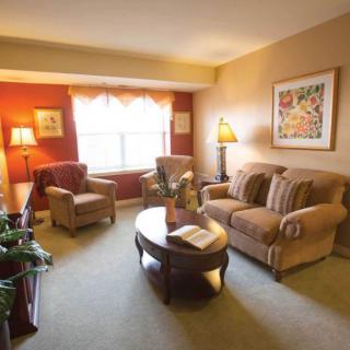 Cozy living room with comfortable seating, a coffee table, and decorative elements.