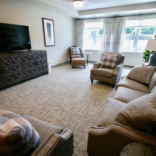 A cozy living room with comfortable seating and a television.