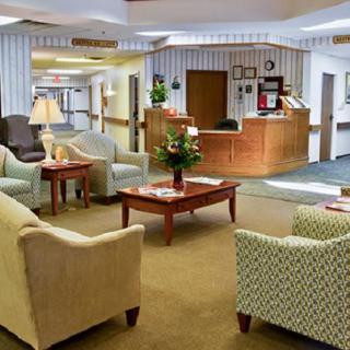 A cozy lobby reception area with comfortable seating and a welcoming atmosphere.
