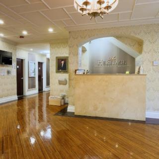 A welcoming reception area featuring elegant design and polished wood flooring.