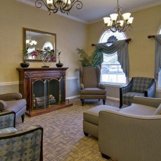 A cozy living room with elegant furniture and a fireplace.
