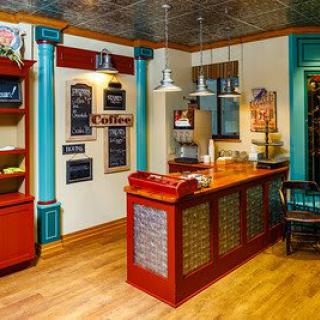 A vintage-style cafe interior with a colorful counter and decorative elements.