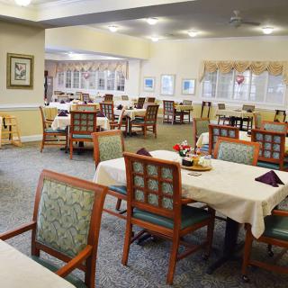 An inviting dining area with neatly arranged tables and chairs.