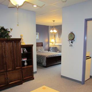 A cozy bedroom with elegant furniture and soft lighting.