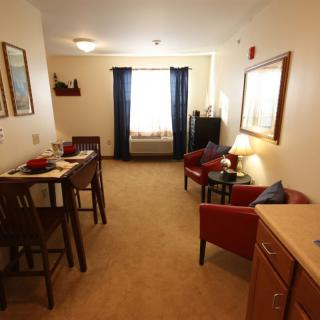 A cozy living room with a dining area and comfortable seating.