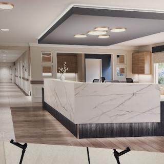 A modern reception area featuring elegant marble countertops and contemporary decor.