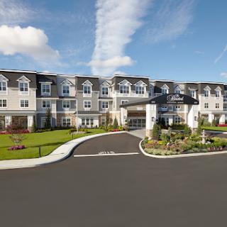 A modern hotel exterior with a welcoming entrance and landscaped surroundings.