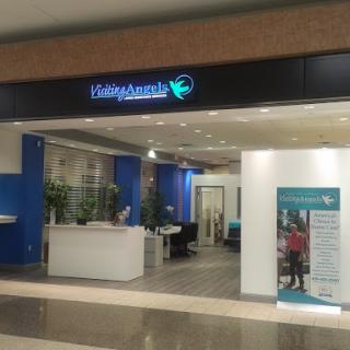 A view of a modern retail office space with blue accents and open layout.