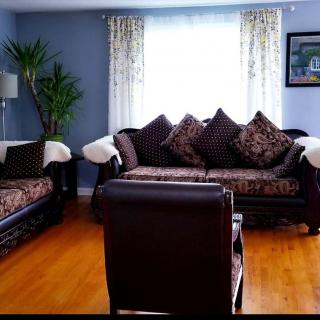 A cozy living room with elegant furniture and decorative elements.