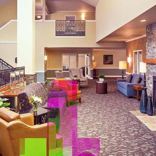 A spacious and modern hotel lobby with comfortable seating and contemporary decor.