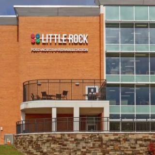 Exterior view of a building with Little Rock signage.