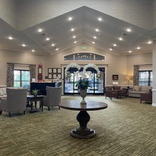 Spacious and welcoming lobby with elegant decor and comfortable seating.