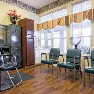 A cozy hair salon with a waiting area and styling station.