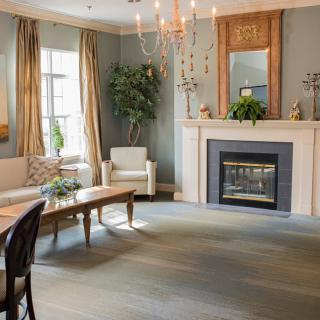 A cozy living room with a fireplace and elegant decor.